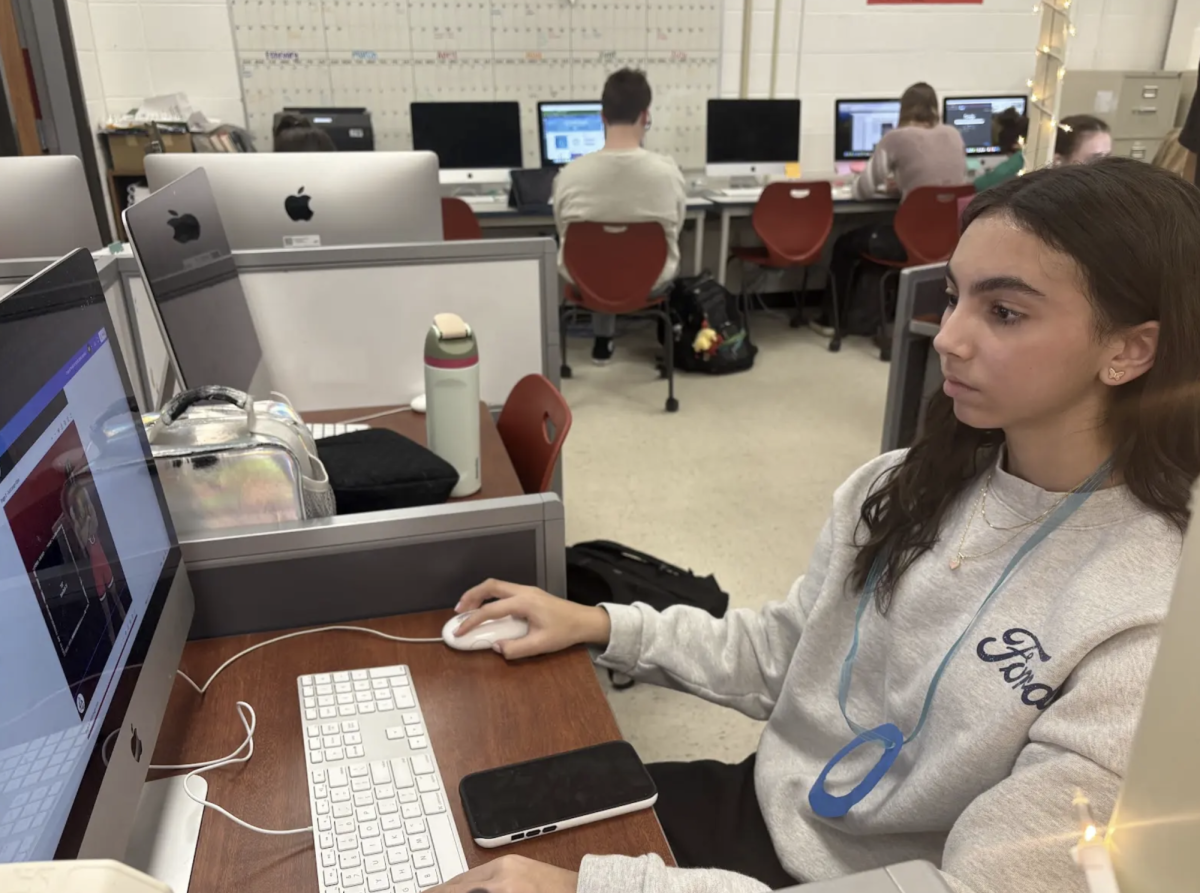 Sophomore Madeleine Iyer is wearing a "O" shape "Scarlet Letter" necklace. Students in sophomore honors English classes made these necklaces after reading the novel "Scarlett Letter". "It's a good way to see into the book and how the main character felt since we are experiencing what she experienced" Iyer said. 